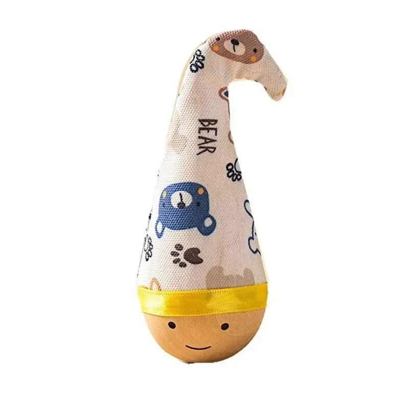 A knitted bear-shaped toy with a yellow collar and patterned fabric, designed as an interactive feather wobble ball cat toy.