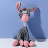 A gray and pink plush toy shaped like a donkey with long ears and a striped nose.