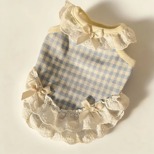A light blue and white checkered summer pet dress for dogs and cats with delicate lace trim and bow details.