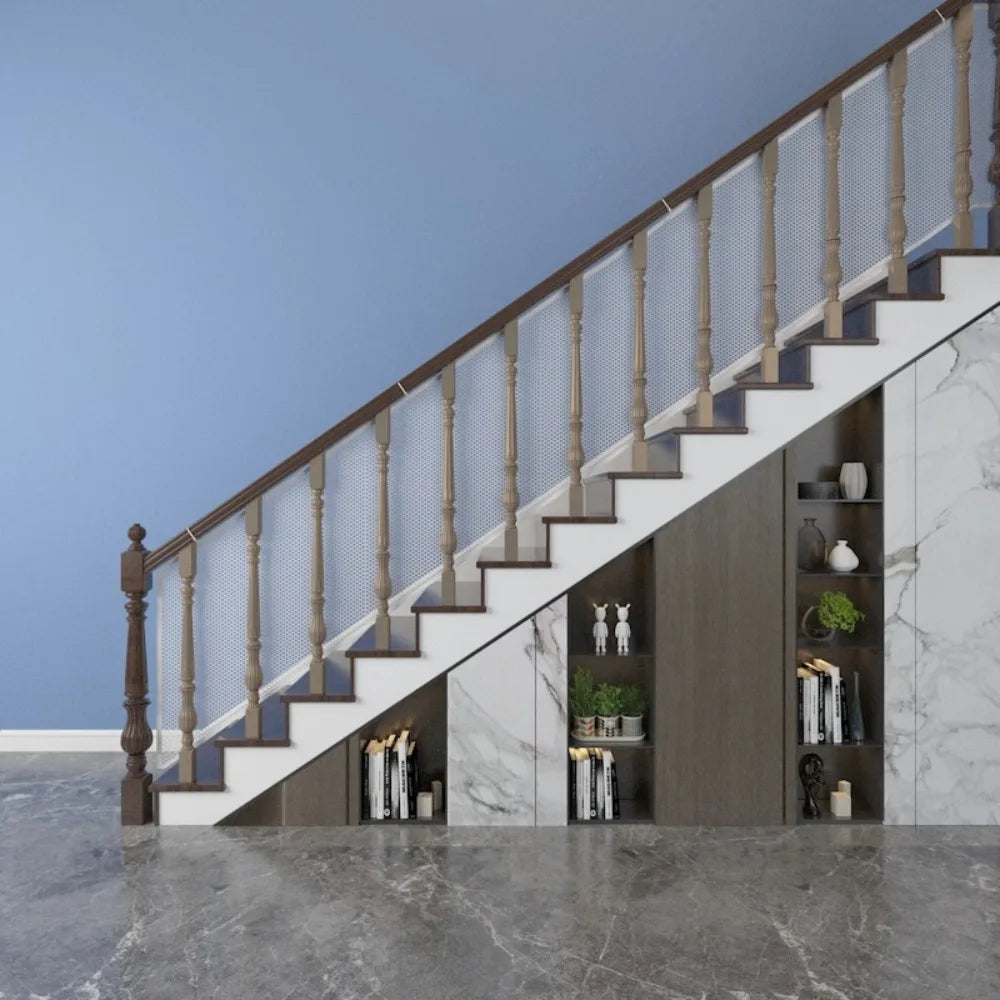 A modern interior featuring a staircase with glass railings and wooden steps against a light gray wall.
