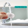 A hand is cleaning a replacement filter under a faucet for pet water fountain use.