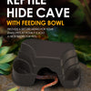 A dark brown reptile hide cave with a feeding bowl is shown on a textured surface.