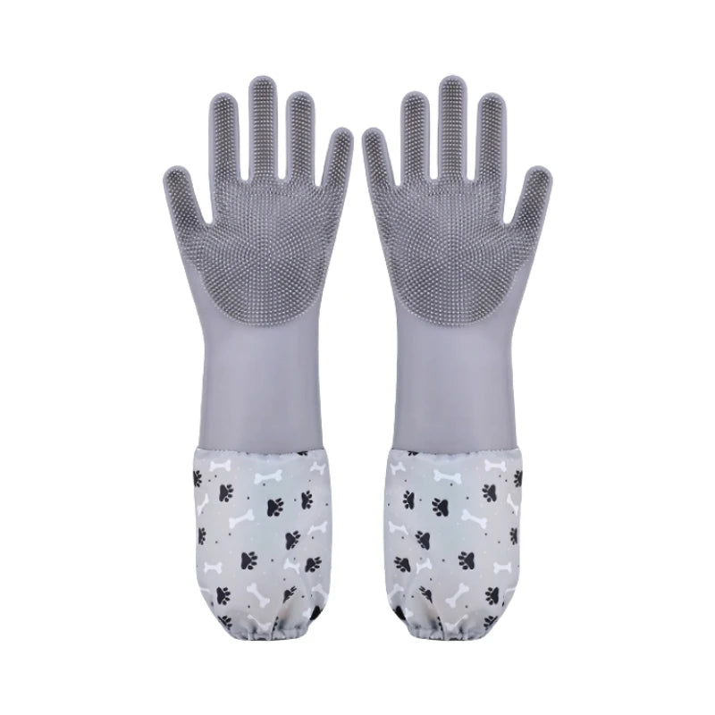 A pair of gray pet grooming gloves for dogs and cats with paw print patterns on the palms.