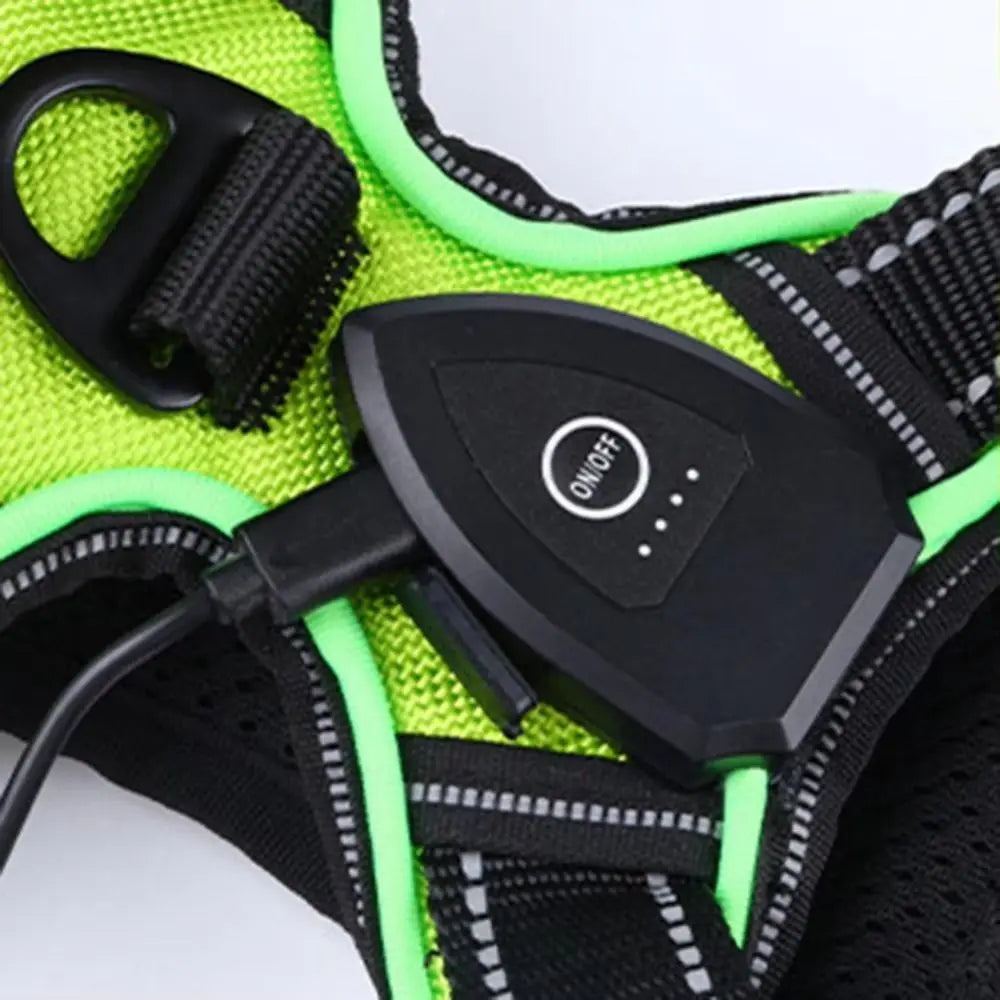 A bright lime green LED dog harness with black straps and reflective strips shown against a white background.