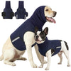 A light-colored dog wearing a navy blue calming anxiety vest, with two separate vests shown separately.