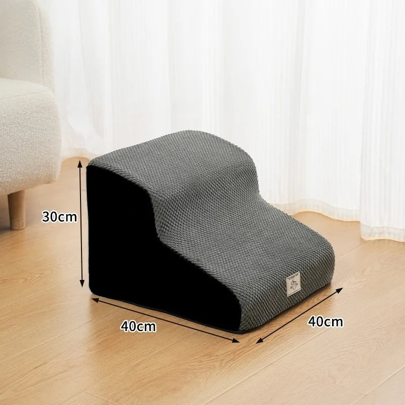 Gray washable non-slip pet stairs used for climbing onto a bed or sofa.
