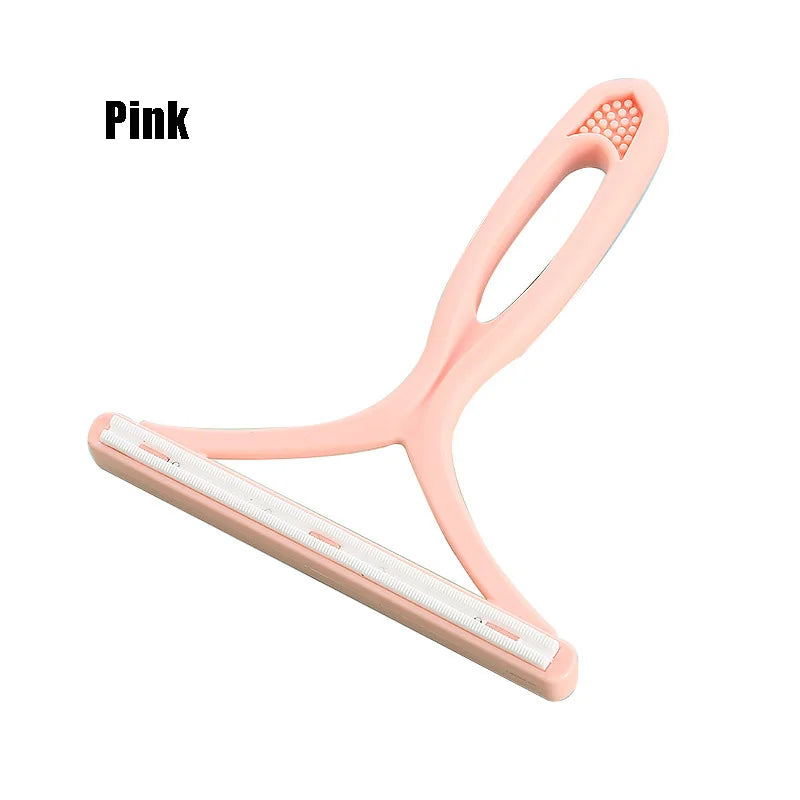 Pink silicone pet hair and lint remover tool with a flexible handle and cleaning strip