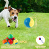 A dog is playing with colorful squeaky chew balls, demonstrating the product for dog teeth cleaning.