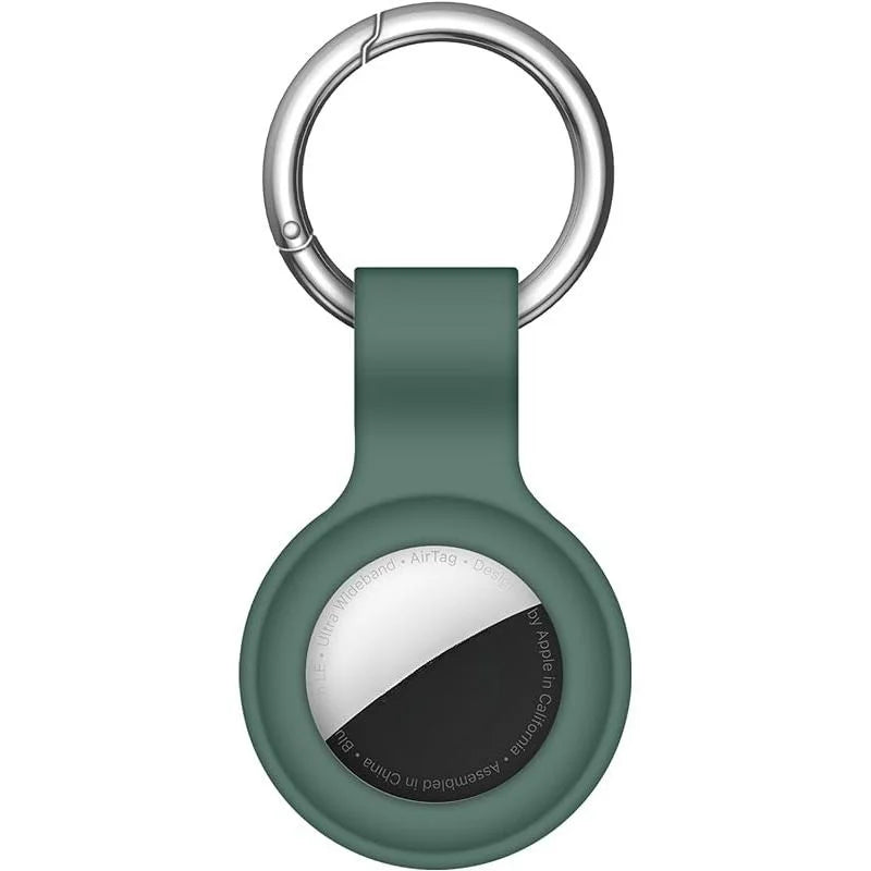 A silicone AirTag protective cover with a metal keychain ring and a dark green body.