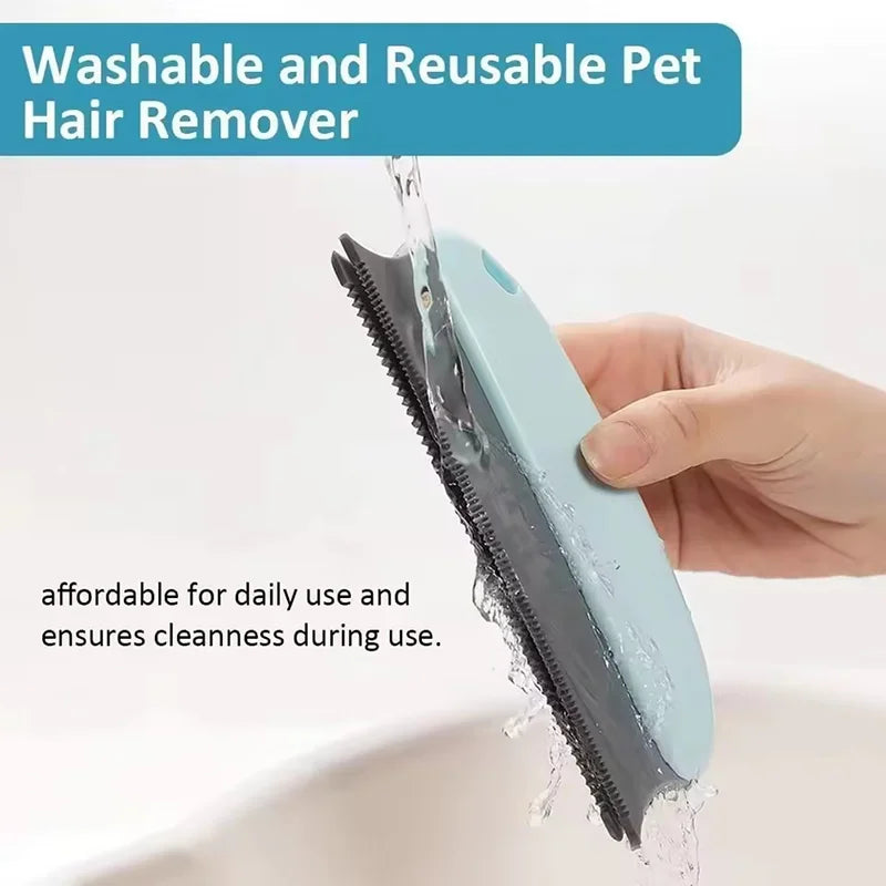 A hand is using a light blue reusable pet hair remover brush to clean surfaces.