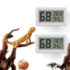 A digital thermometer and humidity gauge displaying 68 degrees and 28.3 Celsius, shown next to a wooden reptile figurine.