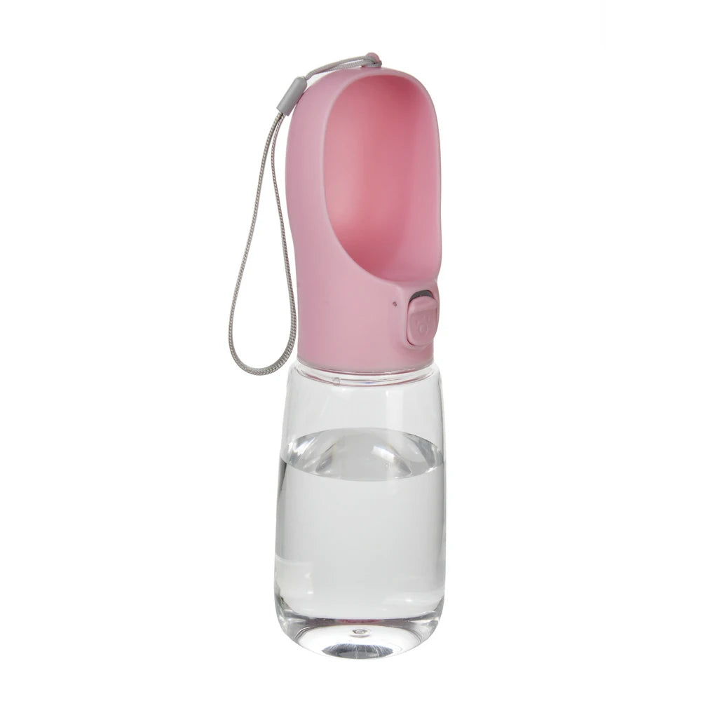 A pink portable leakproof dog water bottle with a built-in bowl and a flexible straw.