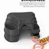 A dark gray, stackable reptile hide cave decoration with food bowls is shown next to a small lizard.