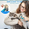 A woman is using a blue pet detangler comb and grooming brush to help reduce shedding on a cat.