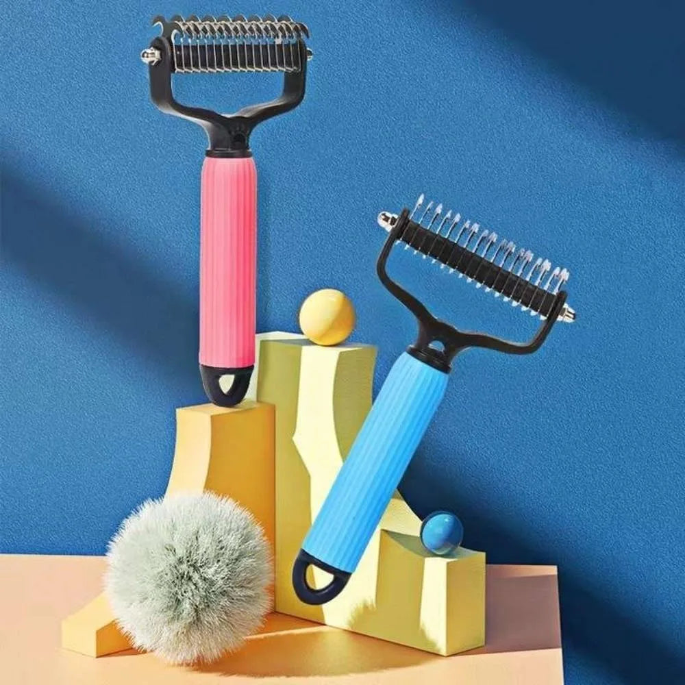 A yellow and pink pet detangling comb is displayed against a blue background with decorative pom-poms.