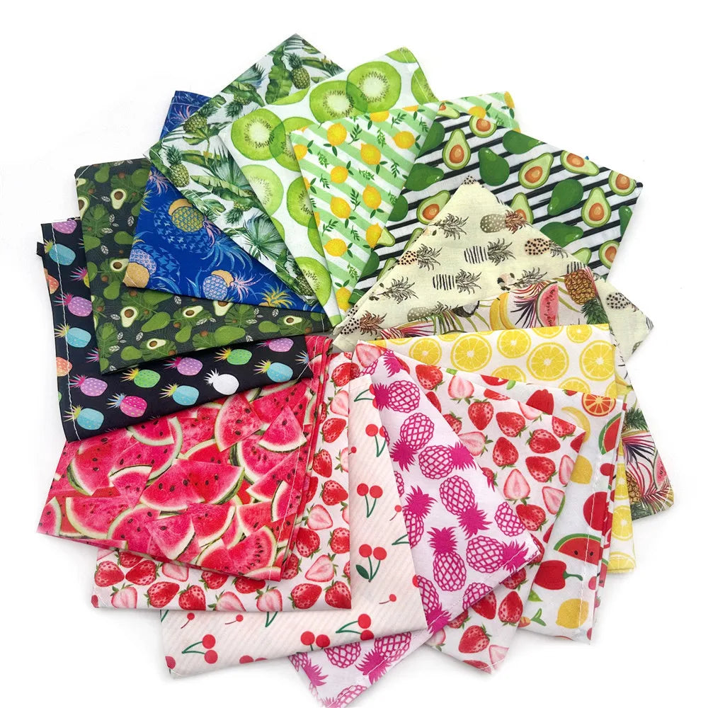 A pile of colorful summer fruit print dog bandanas and triangle scarves made of soft cotton.