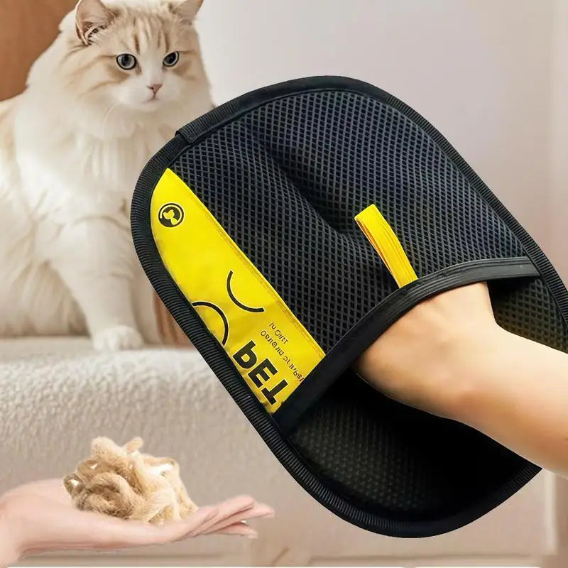 A hand wearing a black pet hair remover glove with a yellow grip is shown next to a white cat.