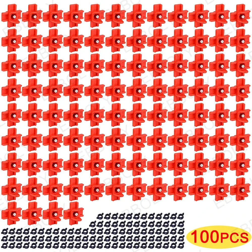 Un jeu de 100 tétines en plastique rouge pour abreuvoirs de poulets automatiques.