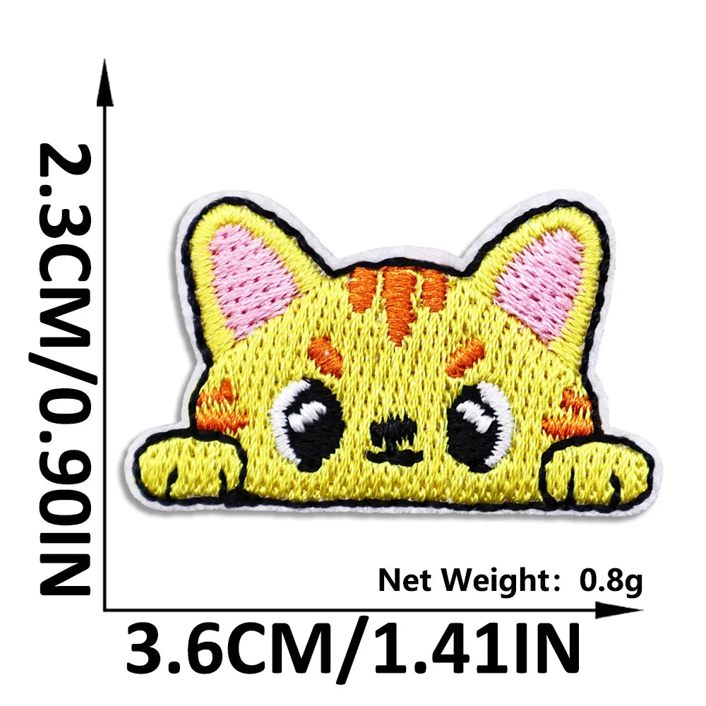 Yellow cat embroidered iron-on patch with pink accents and black details