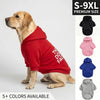 A golden-colored dog wearing a red hoodie with white text against a light background.