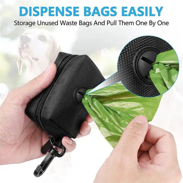A hand is easily dispensing used waste bags from a black dispenser onto a green bag.