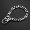A silver stainless steel Cuban link dog collar with a slip chain attached, shown against a dark background.