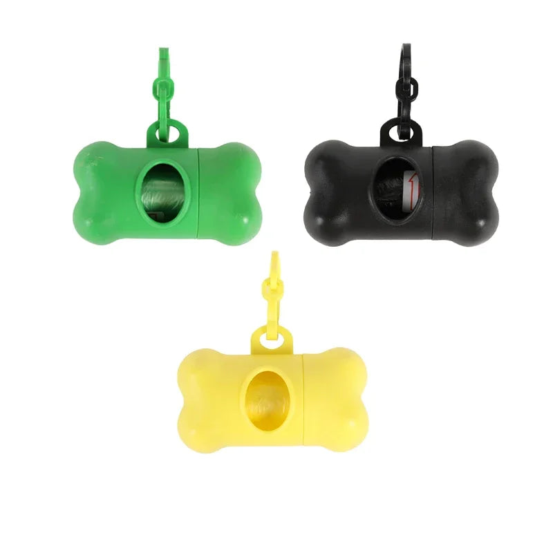 Three bone-shaped dog waste bag dispensers in green, black, and yellow with hanging loops.
