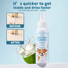 A bottle of Dog Paw Cleaner with coconut oil is shown next to a halved coconut, illustrating the product's effectiveness.