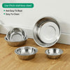 A set of stainless steel pet feeding bowls for dogs and cats displayed on a wooden surface.