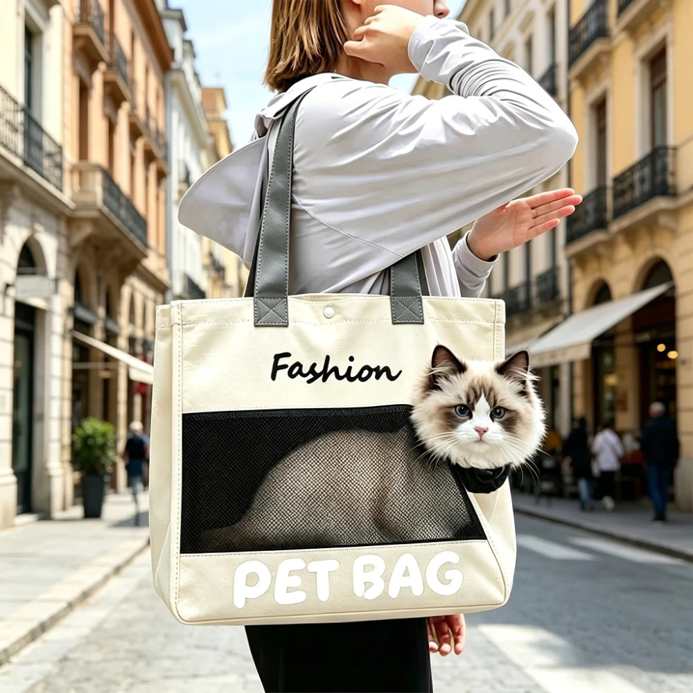A woman is holding a beige pet bag with a black cat design, walking on a city street.