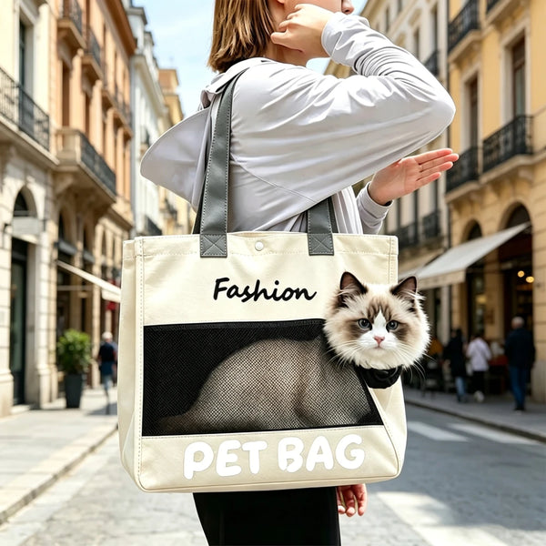 A woman is holding a beige pet bag with a black cat design, walking on a city street.