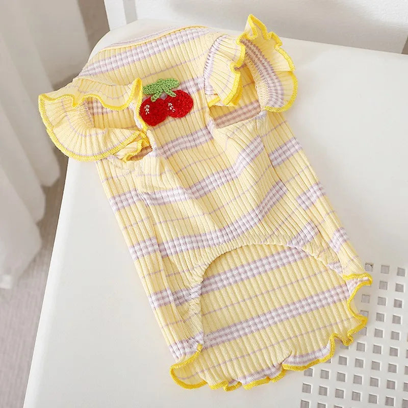 Yellow and white striped dog vest with ruffled trim and a strawberry appliqué