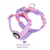 A purple and pink breathable no-pull dog harness with reflective strips.