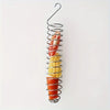 Stainless steel parrot feeder with a spiral basket holding various fruits and vegetables