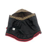 Black outerwear with a brown and gold patterned collar and red trim.
