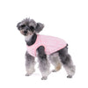 A small, fluffy gray dog wearing a pink soft fleece pet sweater.