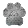 A gray silicone pet licking mat with suction cups designed for dogs and cats.
