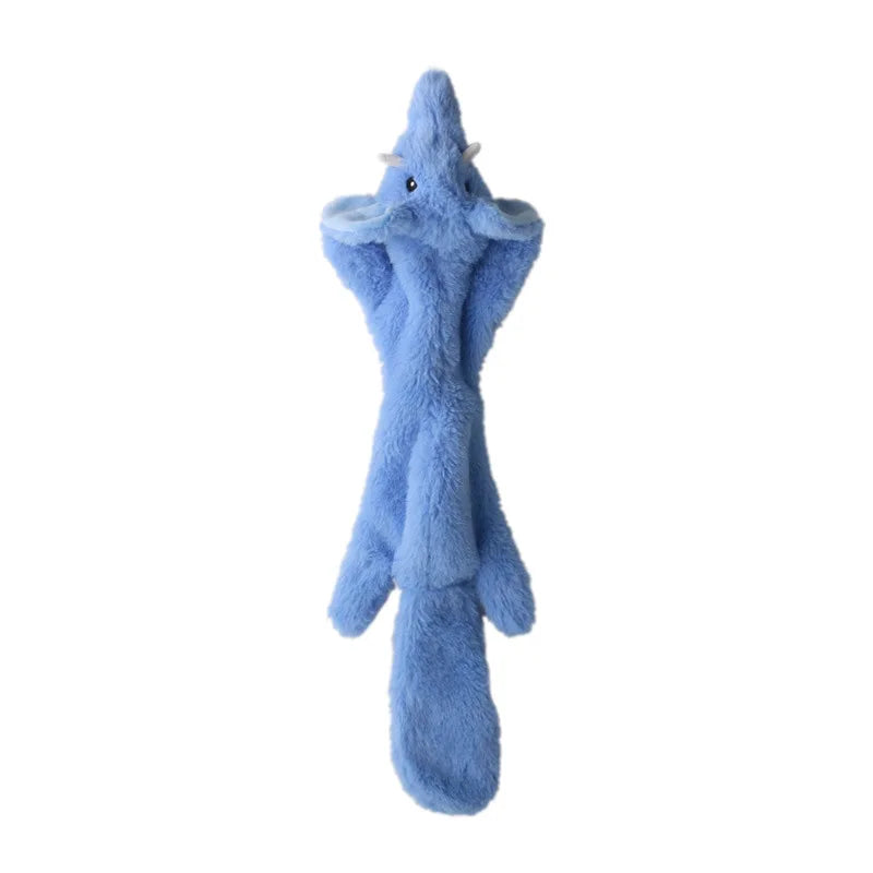 A light blue plush dog toy resembling a dragon or creature with a pointed head and body.