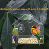 A clear window hanging bird feeder with suction cups, containing bird seed and a small bird.