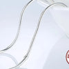A silver snake chain necklace with a heart charm displayed on a white background.