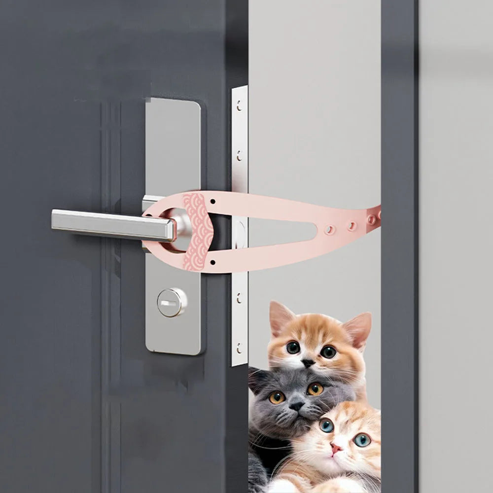 A pink adjustable pet door stopper is installed on a gray door, with a kitten looking out from the gap.