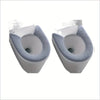 A pair of white toilet seats with gray plush non-slip covers shown from the top view.