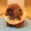 A brown capybara plush doll wearing a light yellow hoodie with green accents.