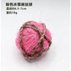 Pink natural grass chew ball made of thin pink fibers wrapped in twine