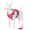 A pink reflective adjustable dog and cat harness with a leash displayed on a white mannequin.