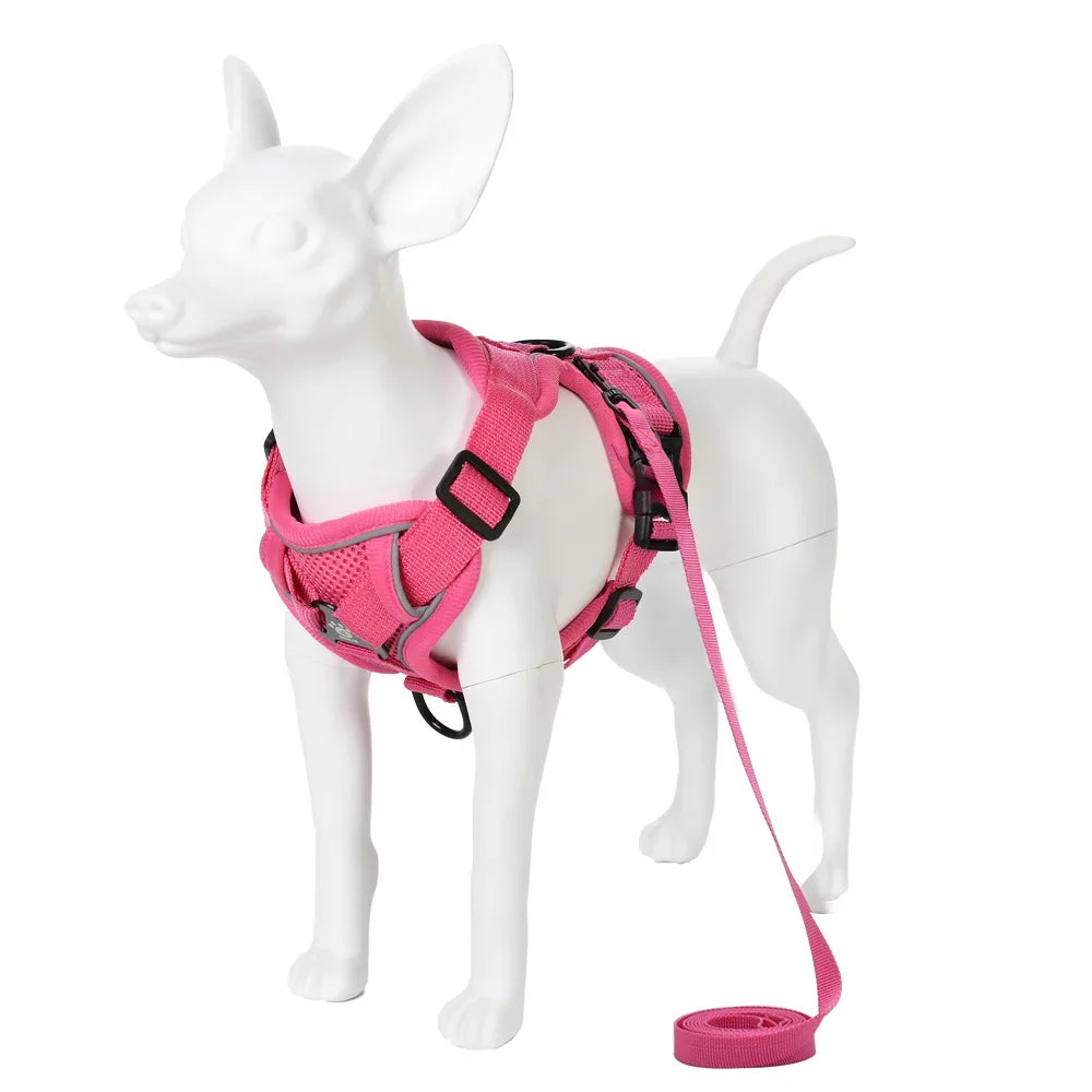 A pink reflective adjustable dog and cat harness with a leash displayed on a white mannequin.