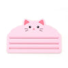 A pink reusable cat food pouch scraper shaped like a cat's face.