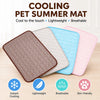 A set of four cooling pet summer mats in brown, beige, blue, and pink are displayed on a wooden surface.
