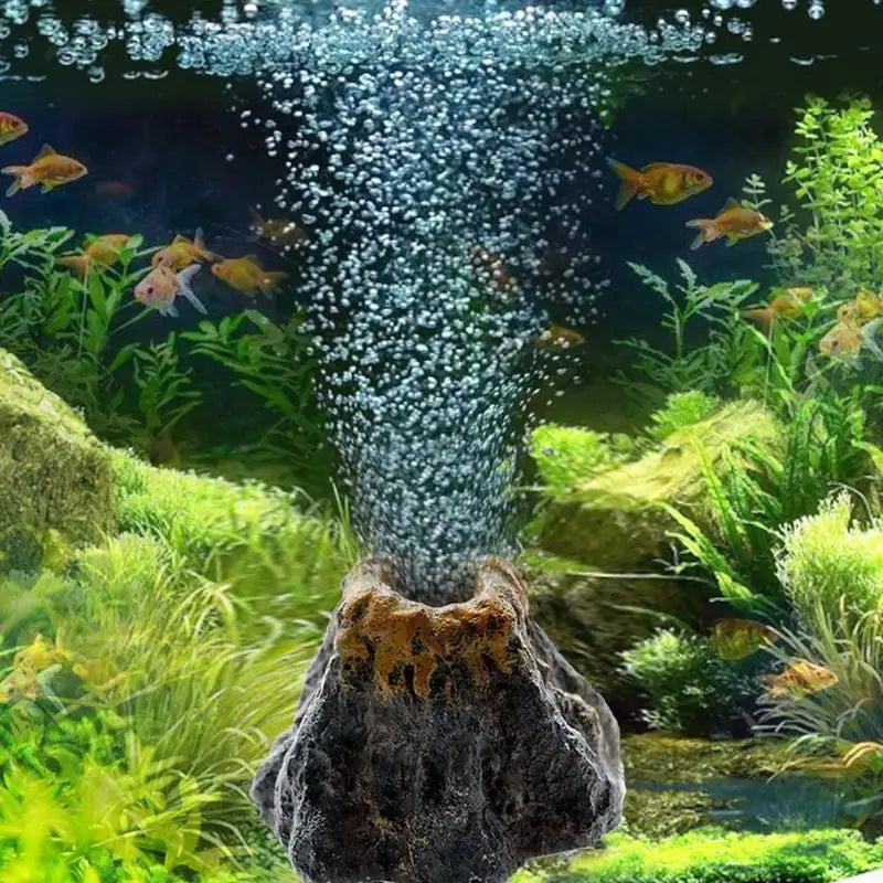 Aquarium volcano bubble stone decoration featuring a mossy rock structure and aquatic plants.