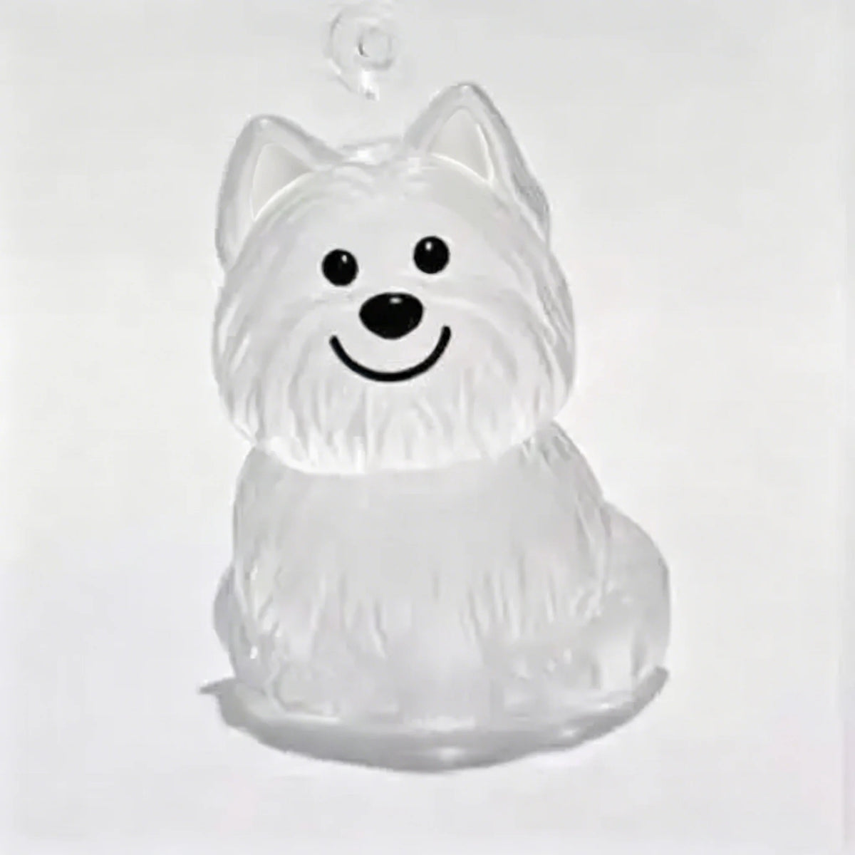 A clear, sculpted figurine of a dog's head and chest, designed as a pet hair memorial keychain.